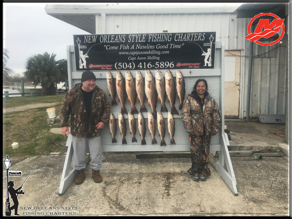 Couple coordinated in outfits and in fishing bounty with New Orleans Style Fishing Charter